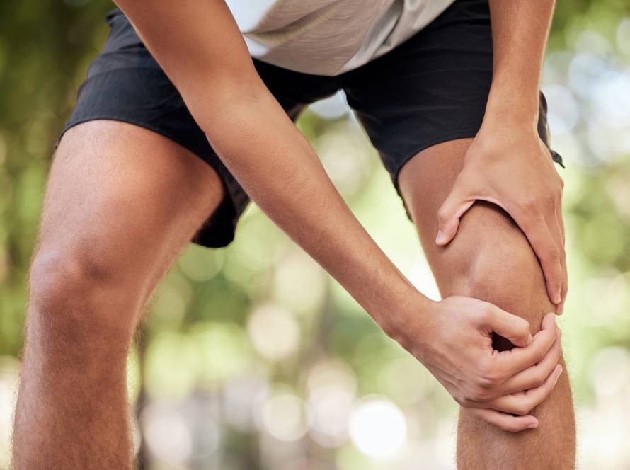 Hands, legs injury and knee pain at park after training, workout or exercise accident. Sports, fitn